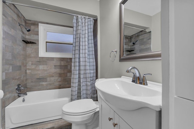 full bathroom featuring hardwood / wood-style flooring, vanity, toilet, and shower / tub combo