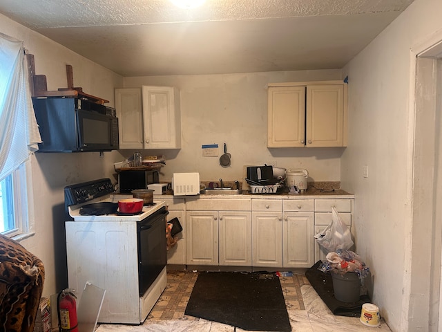 kitchen featuring white cabinetry, sink, and white electric range oven