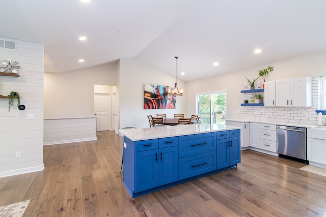 kitchen with dishwasher, white cabinets, hanging light fixtures, blue cabinetry, and tasteful backsplash