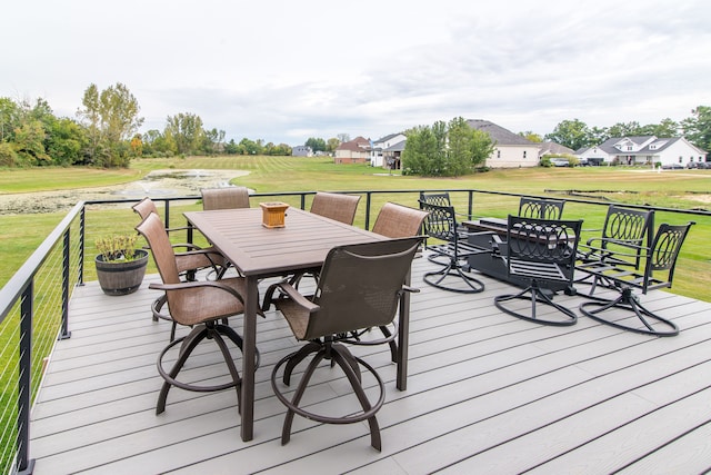 wooden deck featuring a yard