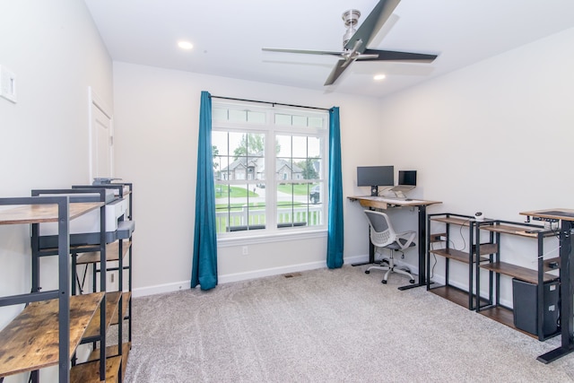 carpeted office with ceiling fan