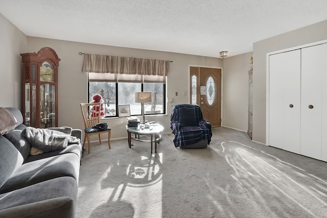 carpeted living room featuring a textured ceiling