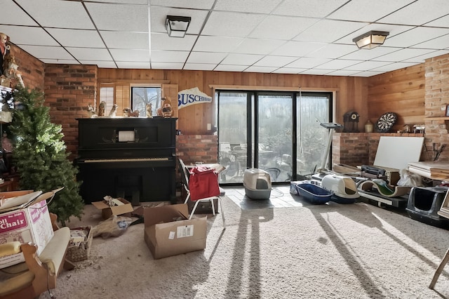 interior space featuring carpet floors and wooden walls