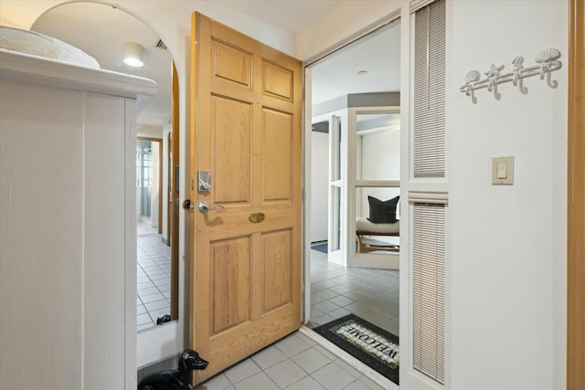 hallway featuring light tile patterned floors