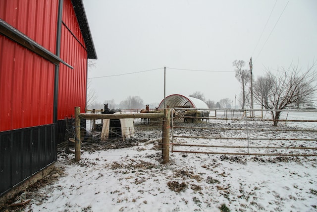 view of yard layered in snow