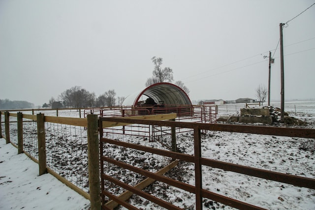 exterior space featuring an outbuilding and a rural view