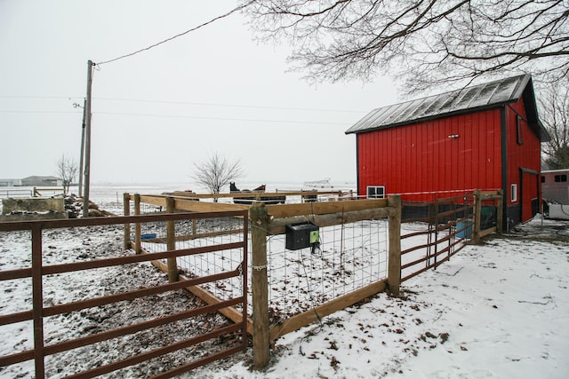 snowy yard with an outdoor structure