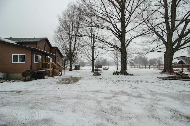 view of yard covered in snow