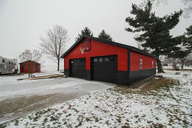 view of snow covered garage