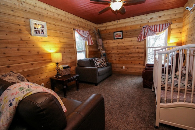 interior space with carpet and ceiling fan