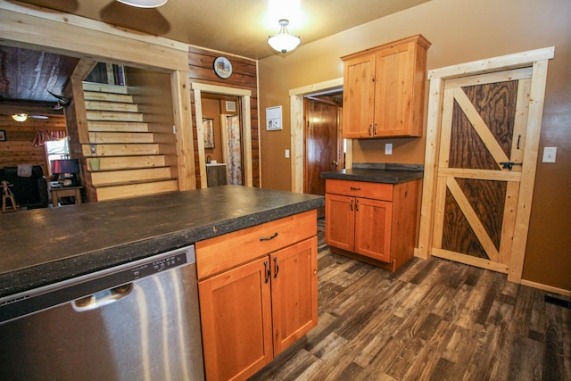 kitchen featuring dishwasher and dark hardwood / wood-style floors