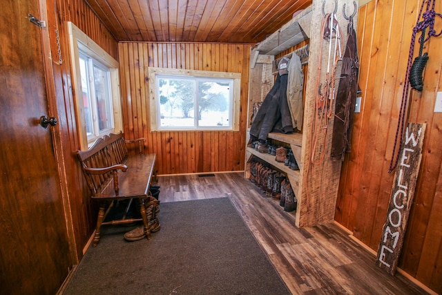 mudroom featuring wood walls, dark hardwood / wood-style flooring, and wood ceiling