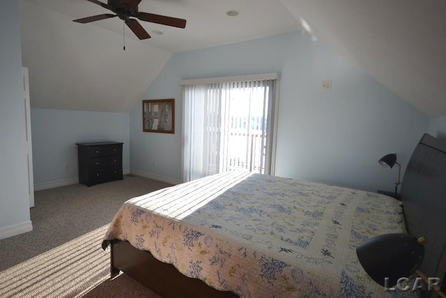 carpeted bedroom featuring ceiling fan and vaulted ceiling