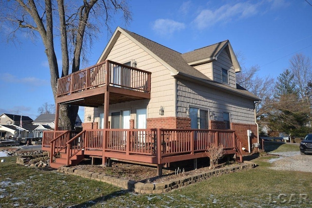 rear view of property featuring a deck