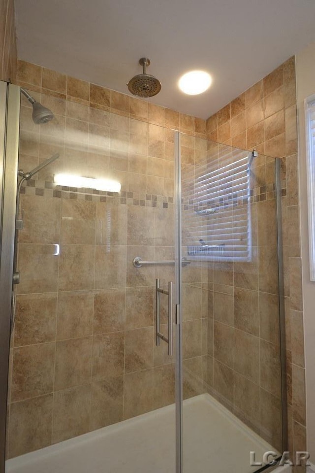 bathroom featuring an enclosed shower