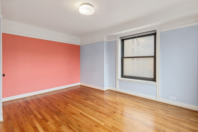 empty room with light hardwood / wood-style floors