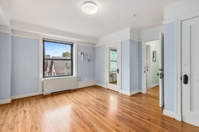 unfurnished room featuring light wood-type flooring