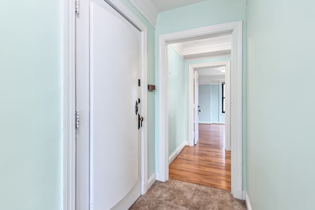 hallway featuring ornamental molding