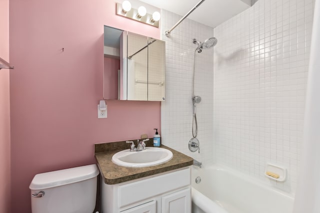 full bathroom featuring vanity, toilet, and tiled shower / bath