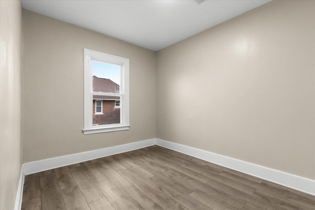 empty room featuring wood-type flooring