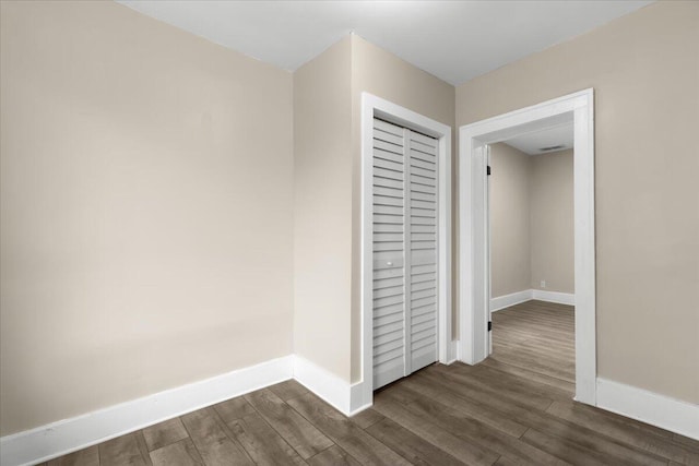 hall with dark hardwood / wood-style flooring