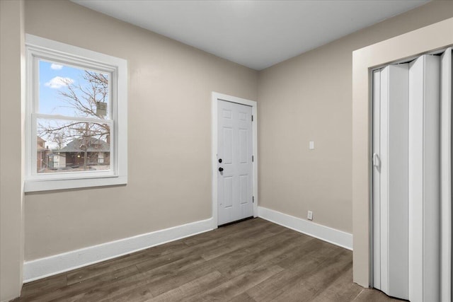 entryway with hardwood / wood-style flooring