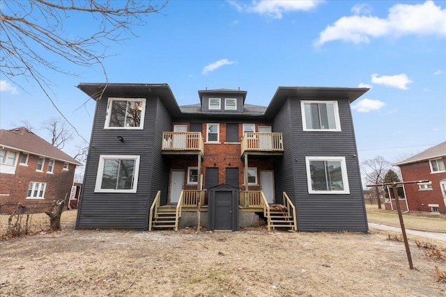 rear view of house with a balcony