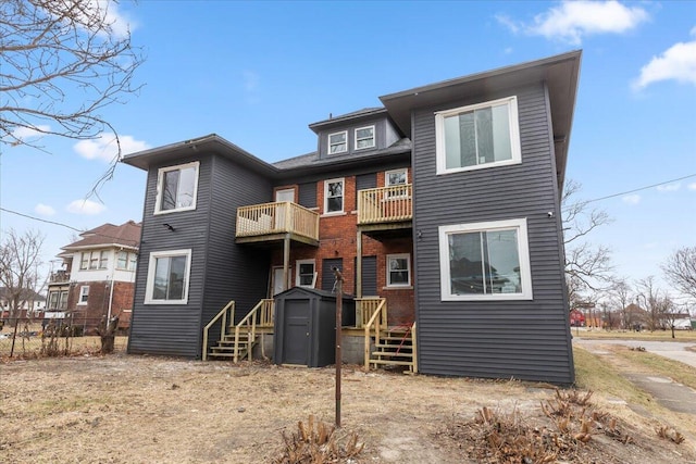 back of house featuring a balcony