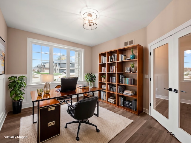 home office with french doors and dark wood-type flooring