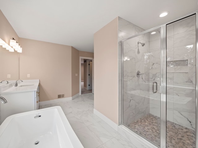 bathroom featuring vanity and separate shower and tub