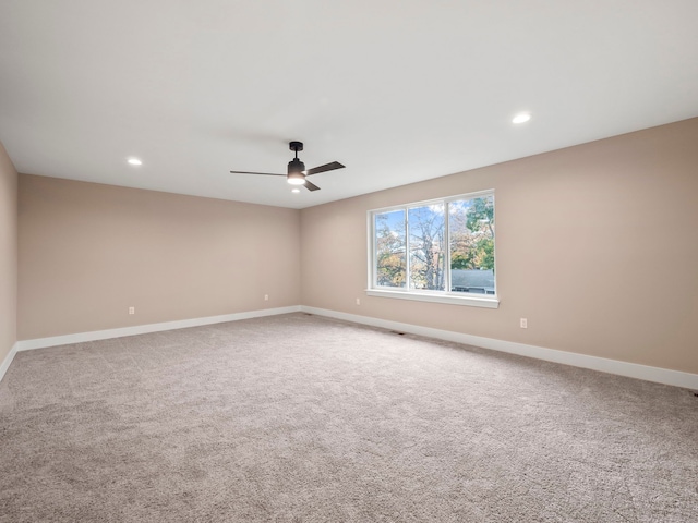 carpeted empty room with ceiling fan