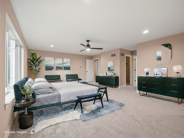 carpeted bedroom featuring ceiling fan