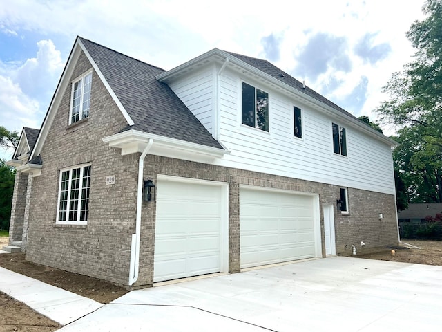 view of side of home with a garage