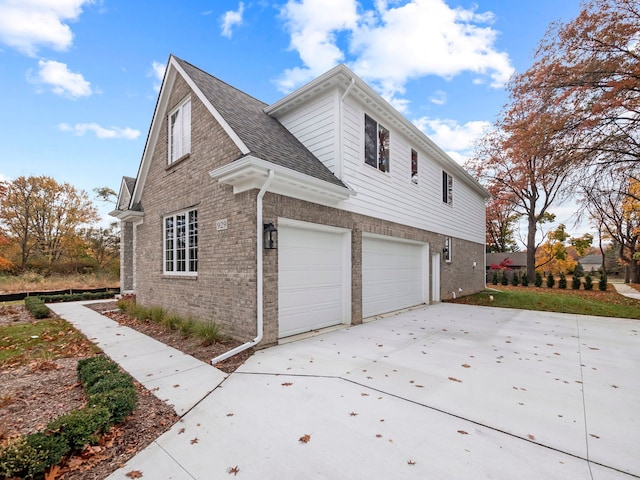 view of side of home with a garage