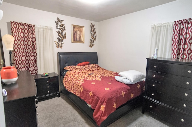 bedroom with light colored carpet