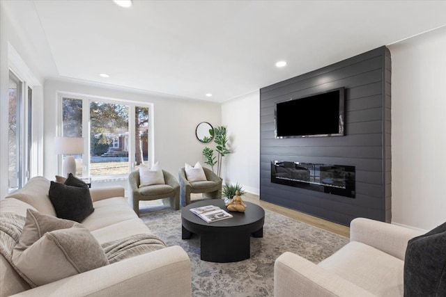 living room with a fireplace and light hardwood / wood-style floors