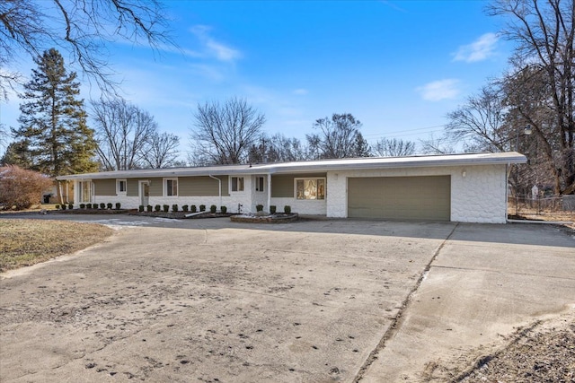 single story home featuring a porch and a garage