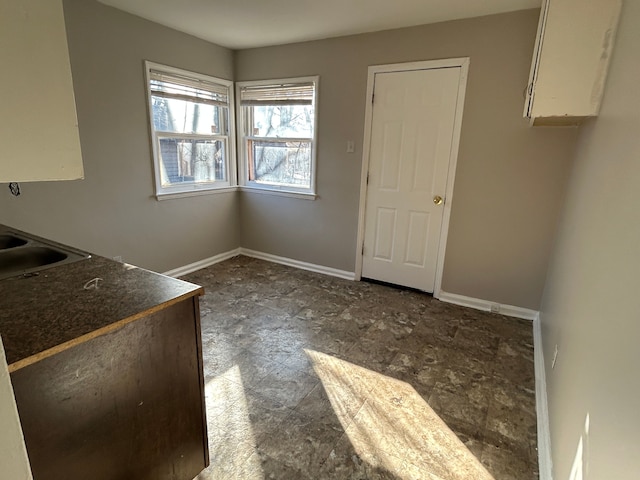 unfurnished dining area with sink