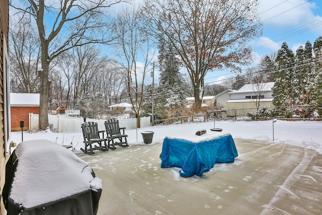 view of yard layered in snow