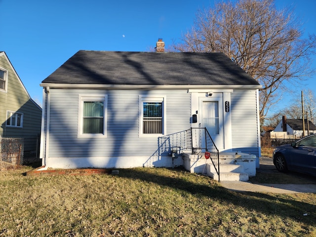 view of front of home with a front lawn