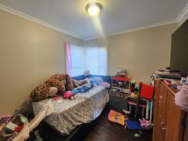 bedroom featuring hardwood / wood-style floors and ornamental molding