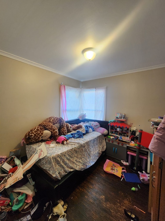 bedroom featuring hardwood / wood-style flooring and ornamental molding