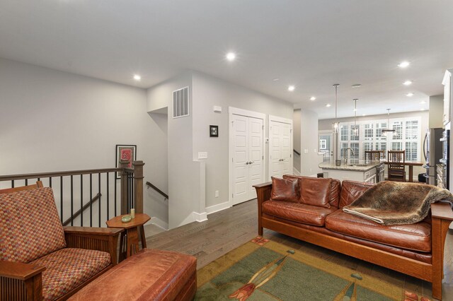 living room featuring dark hardwood / wood-style flooring