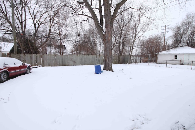 view of yard layered in snow