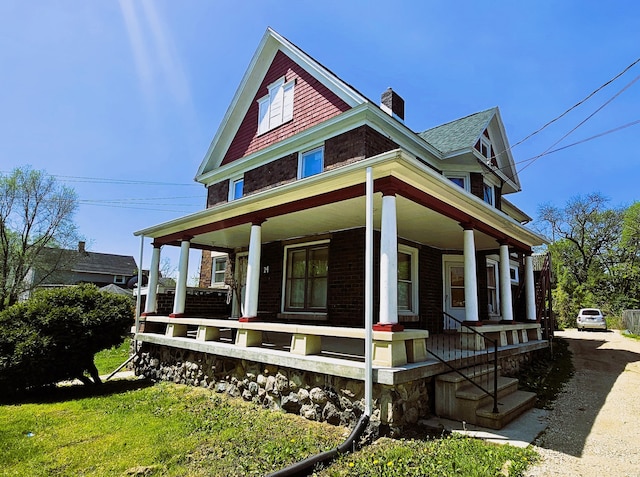 view of property exterior with a porch