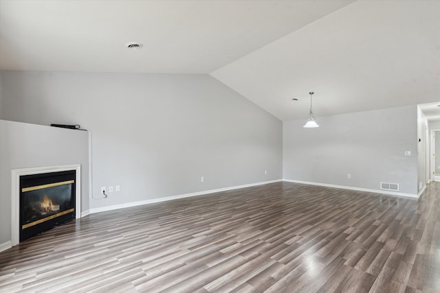 unfurnished living room featuring light hardwood / wood-style flooring and vaulted ceiling