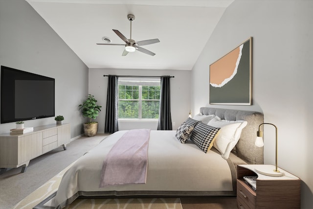 bedroom with carpet flooring, ceiling fan, and vaulted ceiling