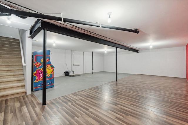 basement featuring hardwood / wood-style floors