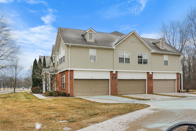 view of front facade featuring a garage and a front lawn