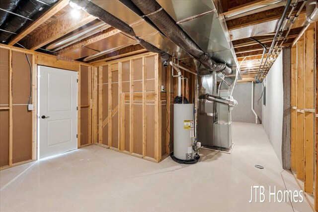 unfinished below grade area with heating unit and gas water heater
